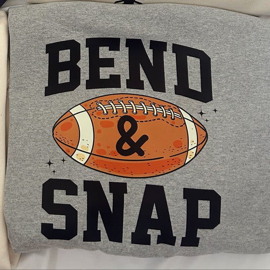 Four t-shirts with various designs and text on a white surface